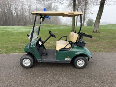 (1) 2015 E-Z-Go golf cart with a Kawasaki gas engine, does not include Club canopy, includes ball wa...