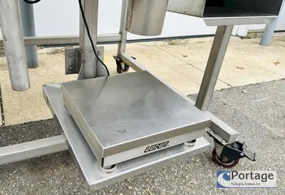 USED HEINZEN MANUFACTURING INTERNATIONAL 2720 MANUAL PACKING TABLE W/ DUAL SCALES