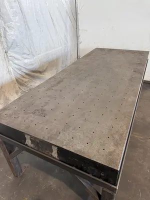 50" X 124" DRILLED & TAPPED STEEL LAYOUT TABLE W/ STAND. STOCK # 0667025.
