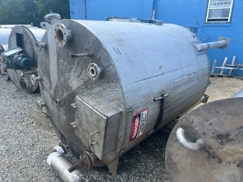 Used approximately 1500 gallon vertical T304L stainless steel tank with internal coil