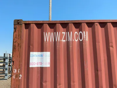 20’ Shipping / Storage Container 8’ wide x 8’ 6” tall, swing doors on one end, wood deck, rings for ...