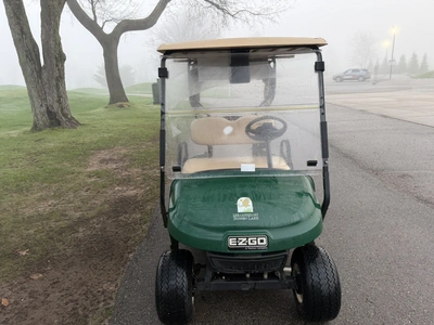 (1) 2015 E-Z-Go golf cart with a Kawasaki gas engine, includes canopy, ball cover, club cover, fold-...