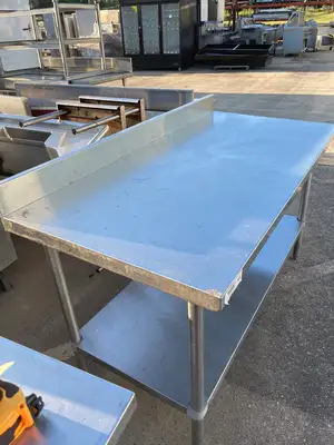 Used Regency Used Regency 30"X60" Stainless Steel Table with Shelf and 4" Backsplash JD - SS322 Food Prep Tables Illinois US | Falcon Restaurant Supply #1375170