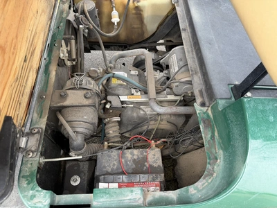 (1) 2015 E-Z-Go golf cart with a Kawasaki gas engine, includes Club canopy, ball washer, fold-down w...
