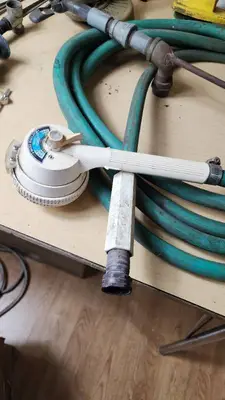 Garden Tools and Equipment including Weed Eater Grass Trimmer, Hose, and Accessories