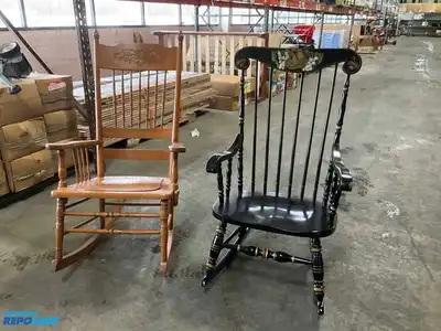 Lot of (2) wooden rocking chairs- brown press back oak rocking chair & black Boston rocker...
