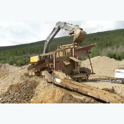 5 ft. Wide x 14 ft. Long wash plant Mounted on Tandem Axle Trailer. Complete With Sluice Box.