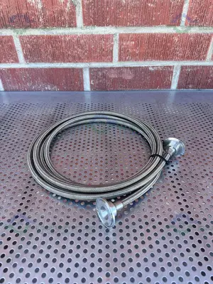 USED FLEXIBLE 200" STAINLESS STEEL BRAIDED HOSE W/ 1"  SANITARY FITTING