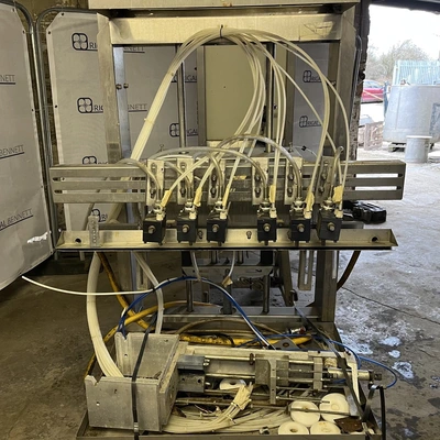 6 Head ELF Filler with feed tanks & container link belt conveyor
