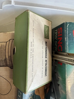 (1) Singer Tiny over edging machine, assorted patterns, and sewing items.