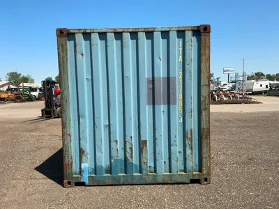 20’ Shipping / Storage Container 8’ wide x 8’ 6” tall, swing doors on one end, wood deck, rings for ...