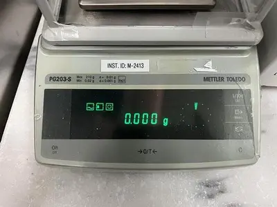 Mettler Toledo model PG203-S analytical scale with LV11 automatic feeder
