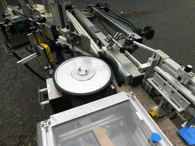 USED NEWMAN WRAP AROUND LABELER NV II