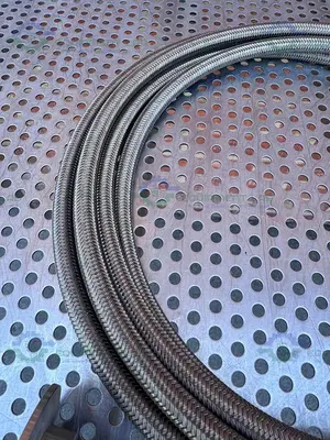 USED FLEXIBLE 200" STAINLESS STEEL BRAIDED HOSE W/ 1"  SANITARY FITTING