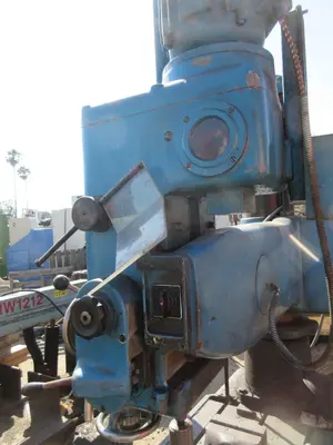 Caser, radial arm drill press
