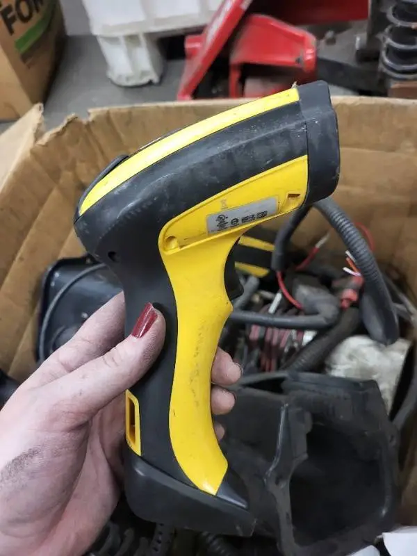 Box of Used Industrial Barcode Scanners and Automotive Parts