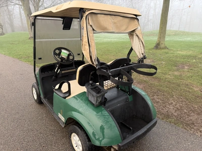 (1) 2015 E-Z-Go golf cart with a Kawasaki gas engine, includes canopy, ball cover, club cover, fold-...