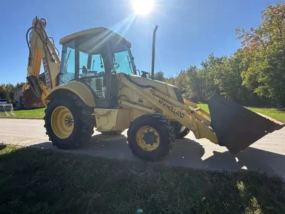 2000 NEW HOLLAND 555E Backhoe Loader | Title Equipment & Recreation Inc. (1)