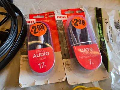 Various audio, video, and network cables, including RCA stereo audio cables, CAT6 network cables, VGA extension cables, USB printer cables, and more.