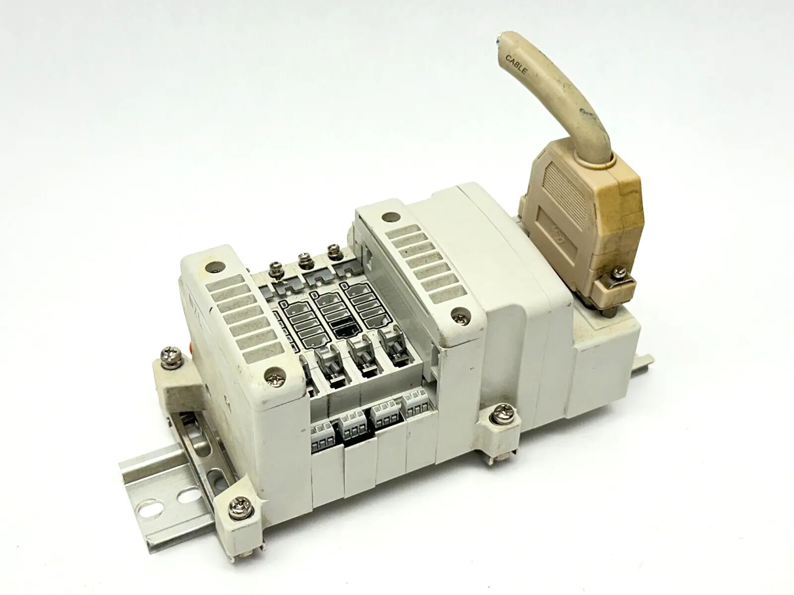 VV5QC11-04N3FD0-S | SMC  Base Mount Plug-In Manifold w/ DIN Rail Brackets - Used