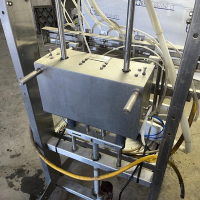 6 Head ELF Filler with feed tanks & container link belt conveyor