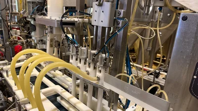 Wild Goose 4 head filler and seamer with depalletizer