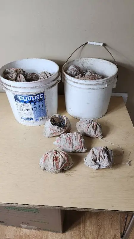 Buckets of Used Cast Iron Pipe Clamps with Bags