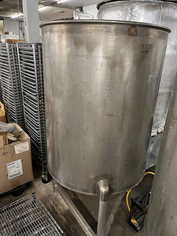 Used approximately 230 gallon stainless steel vertical tank