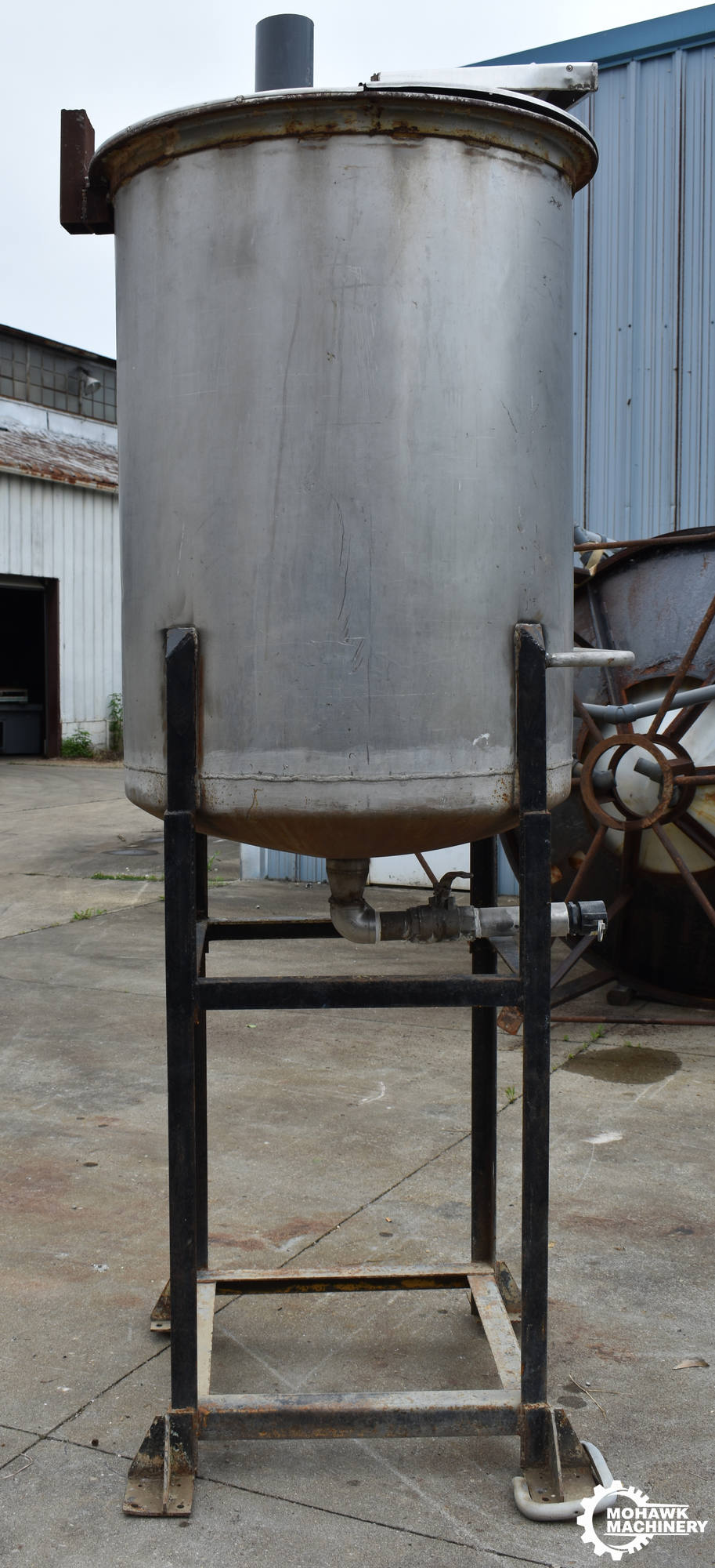167 GALLON (APPROX) VERTICAL STAINLESS STEEEL STORAGE TANK w/FABRICATED STAND - 32” TANK DIAMETER - 48” TANK HEIGHT - CONE BOTTOM