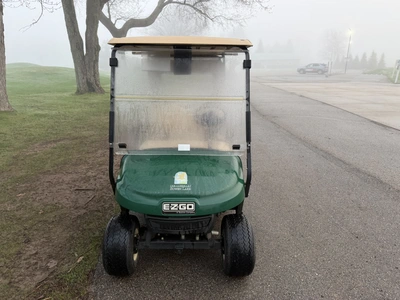 (1) 2015 E-Z-Go golf cart with a Kawasaki gas engine, includes canopy, ball cover, club cover, fold-...