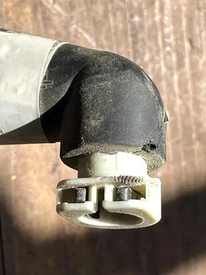 CAT Part # 506-5802.  BACK FLOW / RETURN WHITE PUMP CONNECTOR.  NEW.