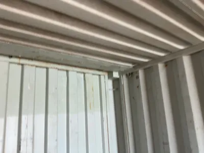 20’ Shipping / Storage Container 8’ wide x 8’ 6” tall, swing doors on one end, wood deck, rings for ...