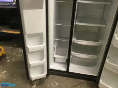 USED GE STAINLESS STEEL AND BLACK SIDE X SIDE REFRIGERATOR HEAVY DUTY ENERGY STAR