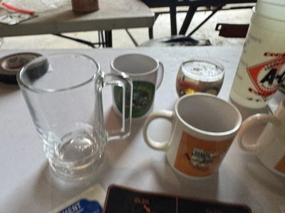 (1) Assorted Allis-Chalmers items including cups, stickers