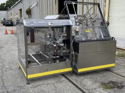 USED ECONOCORP – ECONOSEAL (RANDOLPH, MA) CASE PACKER (ECONOCASER)