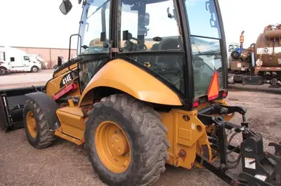 Used 2009 CATERPILLAR 414E IL SKIP /LANDSCAPE LOADER Wheel Loaders Manitoba CA | Conquest Truck & Auto Sales #1421330
