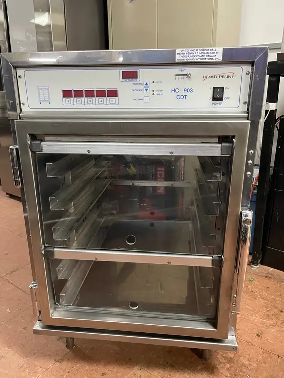 Used Henny Penny Used Henny Penny HC-903 CDT Heated Holding Pass Thru Cabinet with Flip Doors and Timers 120V Hot Food Warming, Holding, & Transport Cabinets Illinois US | Falcon Restaurant Supply #1375758