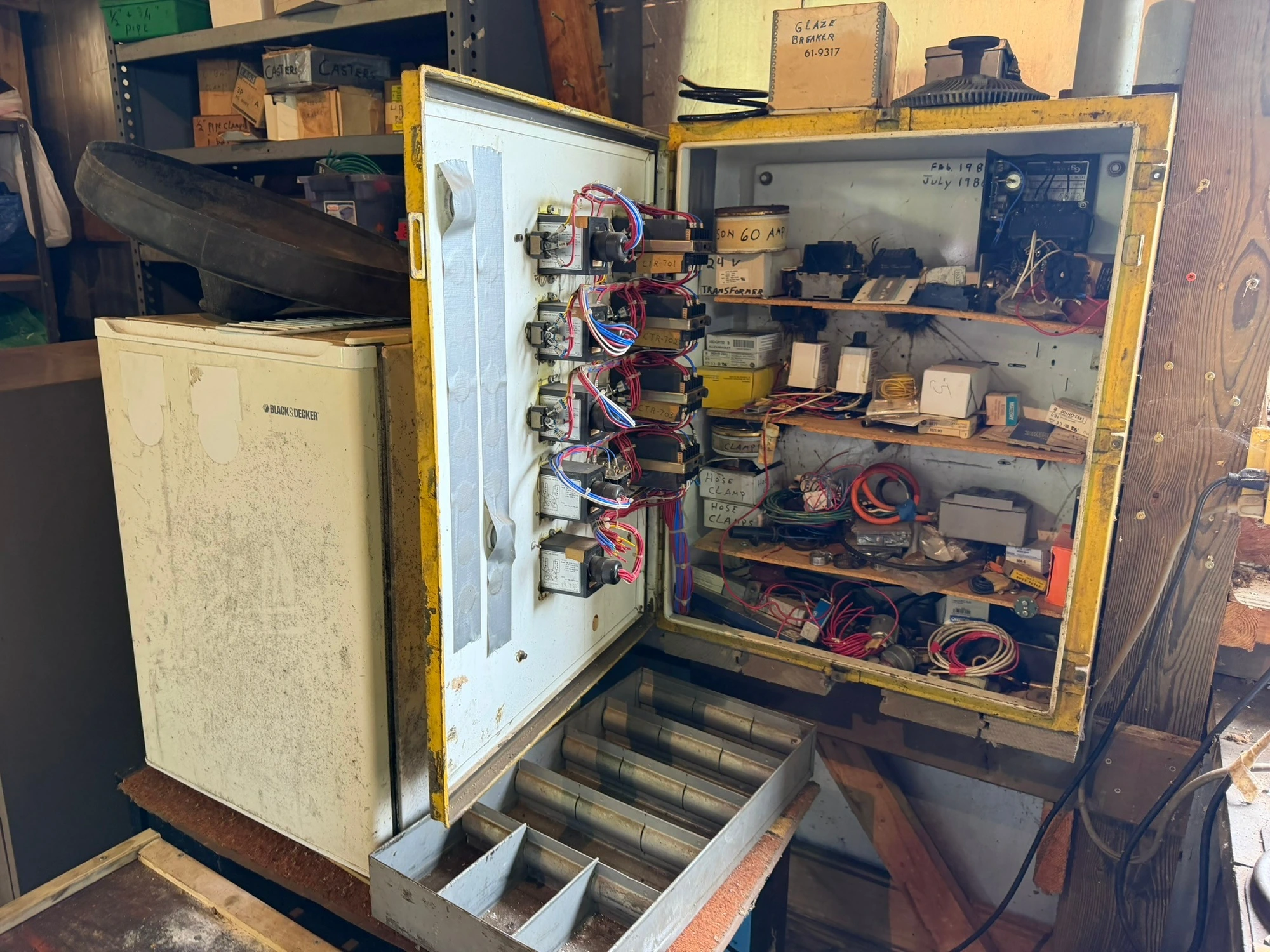 (1) control cabinet filled with assorted electrical items, includes screws, wire, terminals, hose cl...