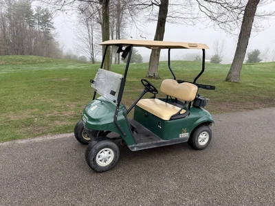 (1) 2015 E-Z-Go golf cart with a Kawasaki gas engine, does not include Club canopy, includes ball wa...