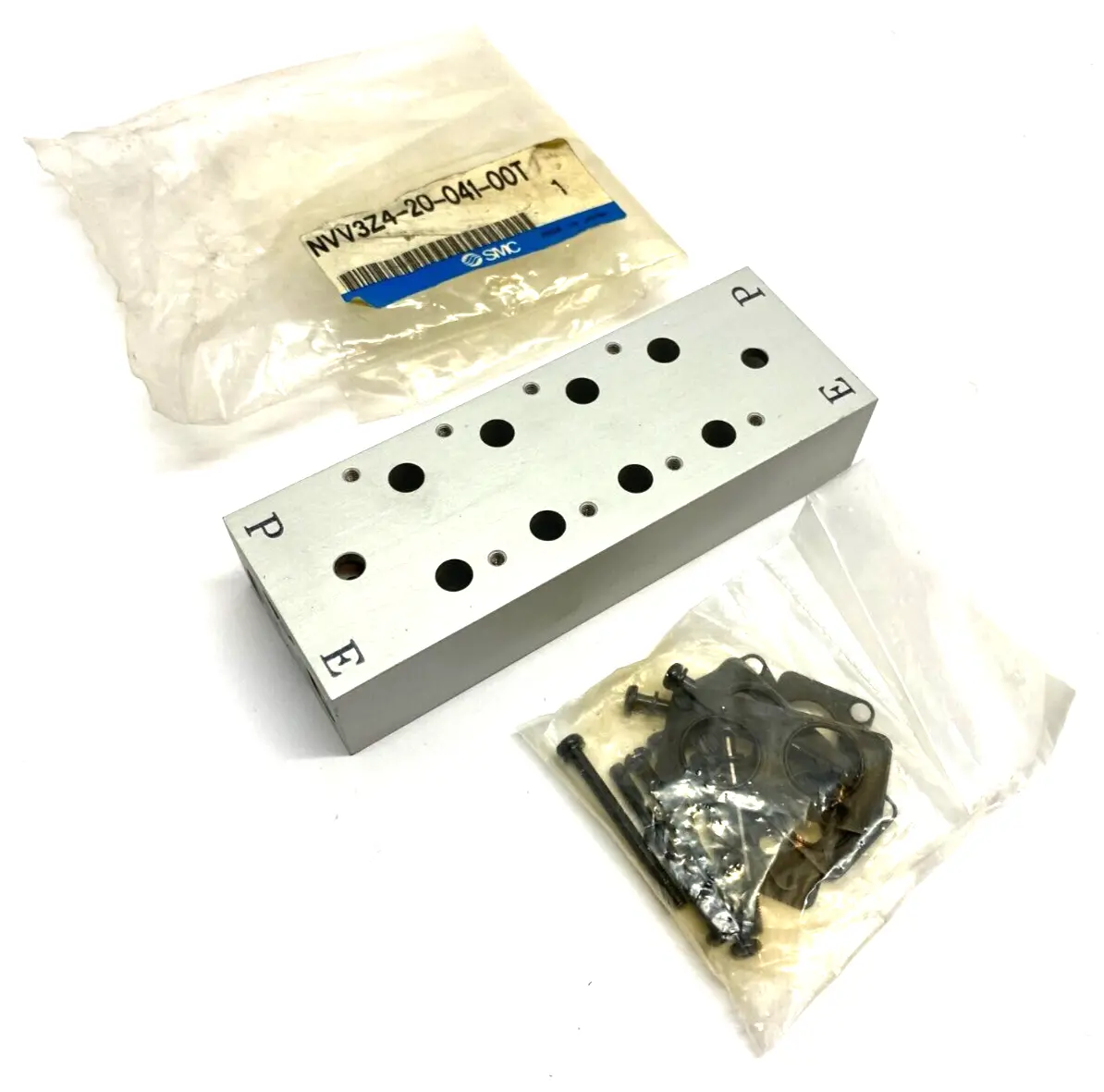 NVV3Z4-20-041-00T | SMC  Pneumatic Manifold Block 4-Station 3-Port - New Other