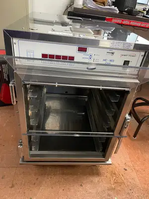 Used Henny Penny Used Henny Penny HC-903 CDT Heated Holding Pass Thru Cabinet with Flip Doors and Timers 120V Hot Food Warming, Holding, & Transport Cabinets Illinois US | Falcon Restaurant Supply #1375758