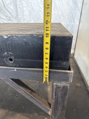 50" X 124" DRILLED & TAPPED STEEL LAYOUT TABLE W/ STAND. STOCK # 0667025.