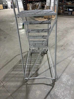 Uline - 6-Step Rolling Ladder - Bent Frame, requires repair

Seller will assist with loading.  Forkl...