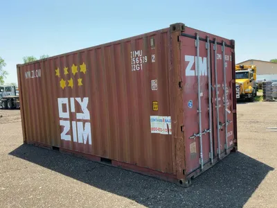 20’ Shipping / Storage Container 8’ wide x 8’ 6” tall, swing doors on one end, wood deck, rings for ...