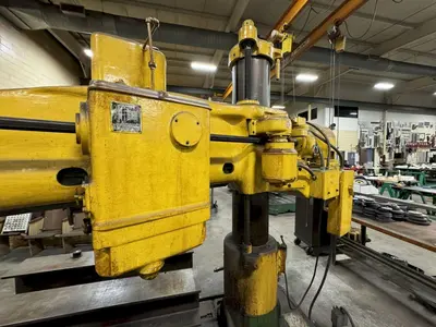 4' X 11" CARLTON RADIAL ARM DRILL. STOCK # 1114024.