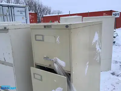 Lot of (2) metal filing cabinets with 4 drawers approx. 15”x29”x52” (one has handles)