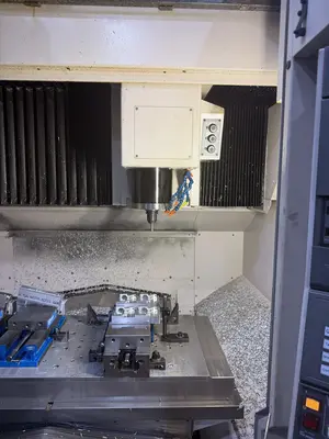 USED 2011 OKUMA GENOS 560V