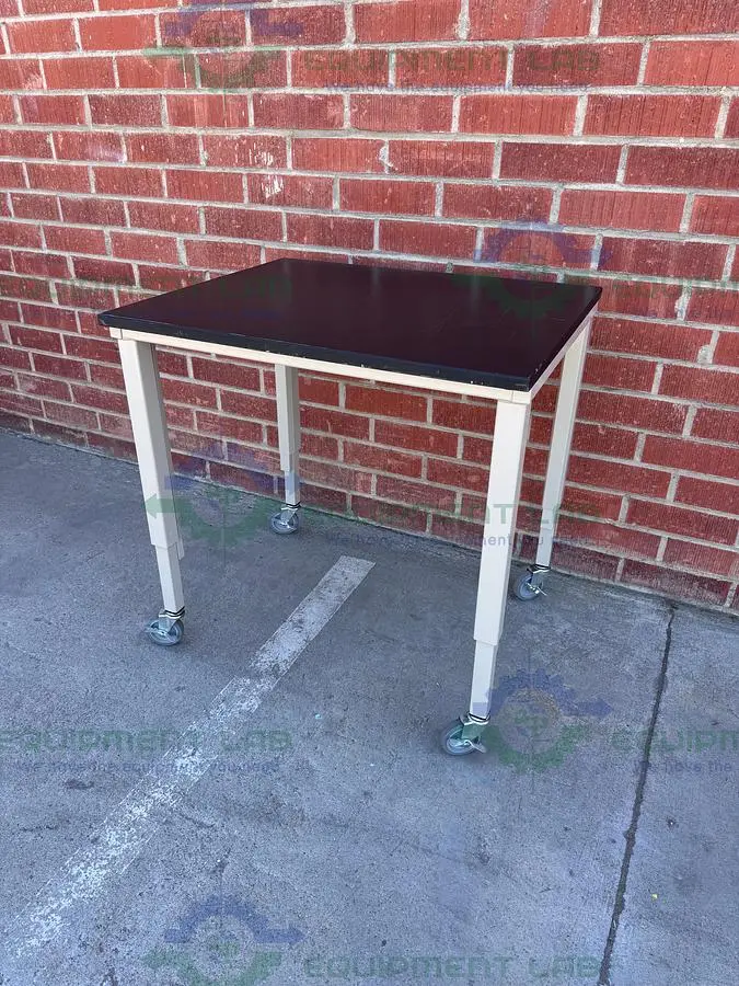 USED PHENOLIC / COMPOSITE RESIN ADJUSTABLE  SCIENCE TABLE WITH WHEELS-30" W X 36" L