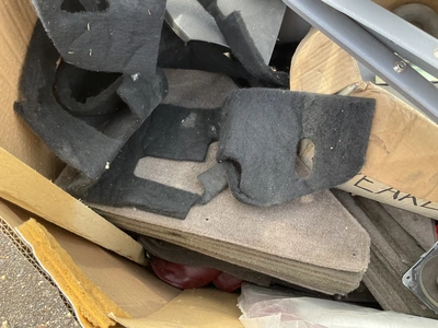 Skid of used semi truck truck interior parts including dash panels, trim, climate control panels, ve...