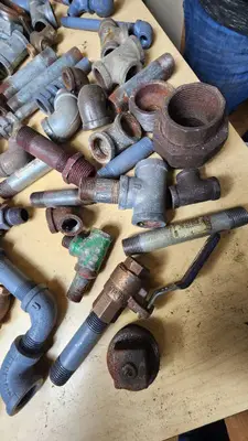 Lot of Plumbing Hardware and Fittings including Galvanized Nipples, Elbows, Valves, and Connectors